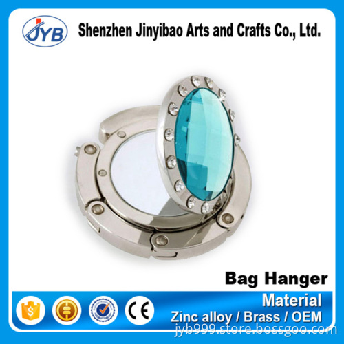 high quality strong fashion design round diamond bag hanger for women